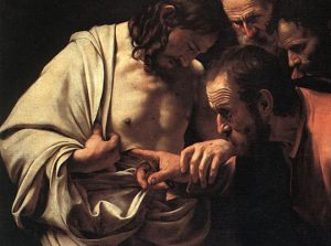 Thomas puts his finger in Jesus' side to prove He's alive.